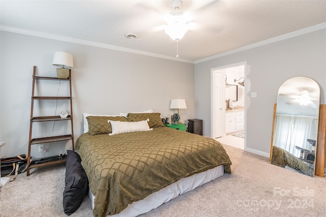 carpeted bedroom featuring ornamental molding, ceiling fan, and ensuite bath