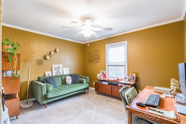 carpeted home office featuring a textured ceiling, ceiling fan, and crown molding