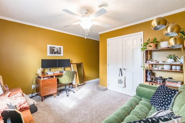 carpeted office space with ceiling fan, a textured ceiling, and ornamental molding