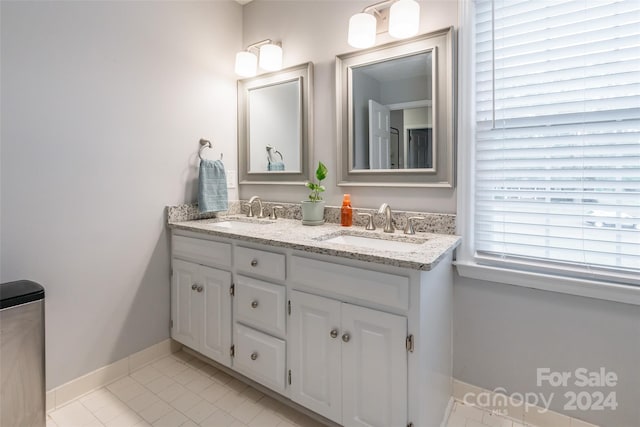 bathroom featuring vanity and tile patterned flooring