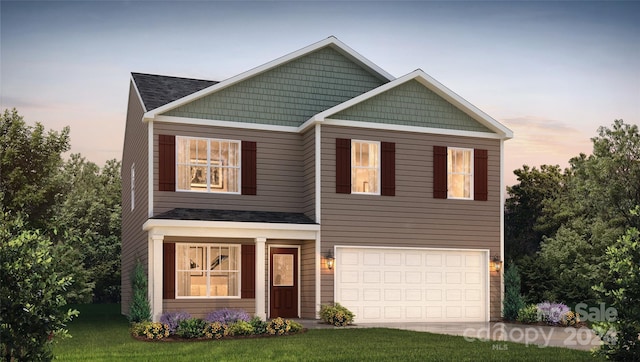 craftsman inspired home featuring a garage and a yard