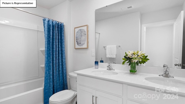 full bathroom featuring shower / bathtub combination with curtain, toilet, and vanity