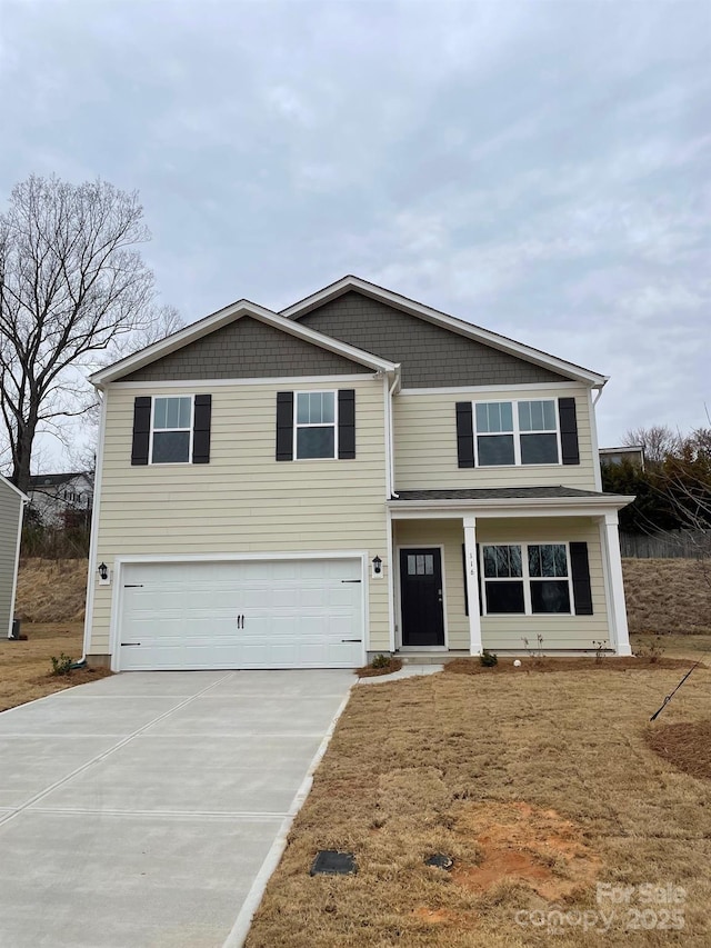 view of front facade with a garage and driveway