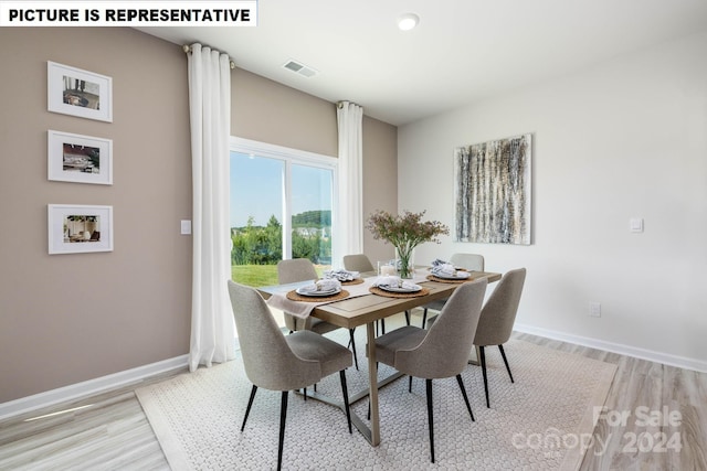 dining area with light wood-type flooring