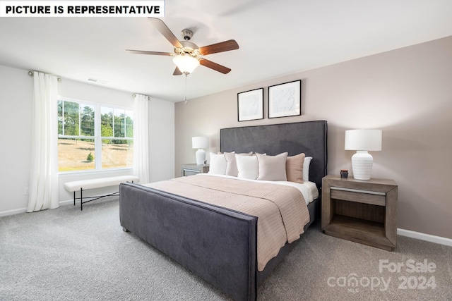 bedroom featuring ceiling fan and carpet floors