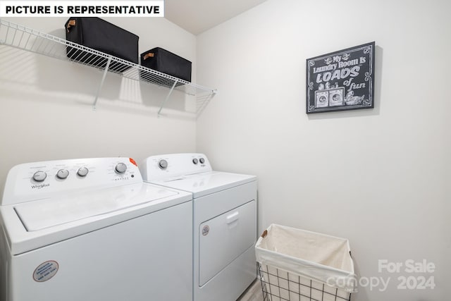 laundry room featuring separate washer and dryer