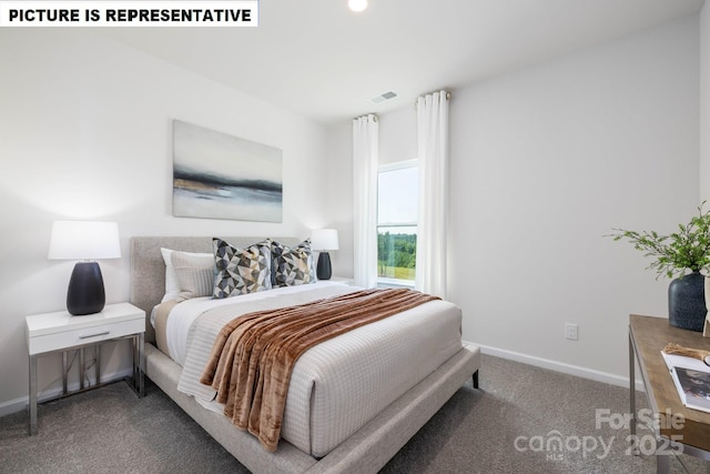 bedroom with baseboards, visible vents, and carpet flooring