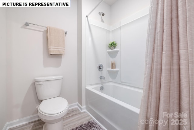 full bath featuring toilet, shower / bath combination with curtain, baseboards, and wood finished floors