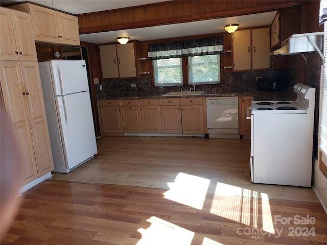 kitchen with light hardwood / wood-style floors, sink, decorative backsplash, white appliances, and extractor fan