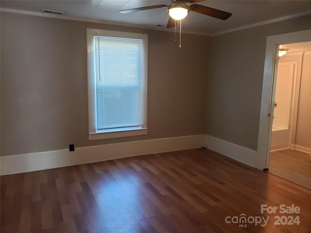 spare room featuring crown molding, hardwood / wood-style floors, and ceiling fan