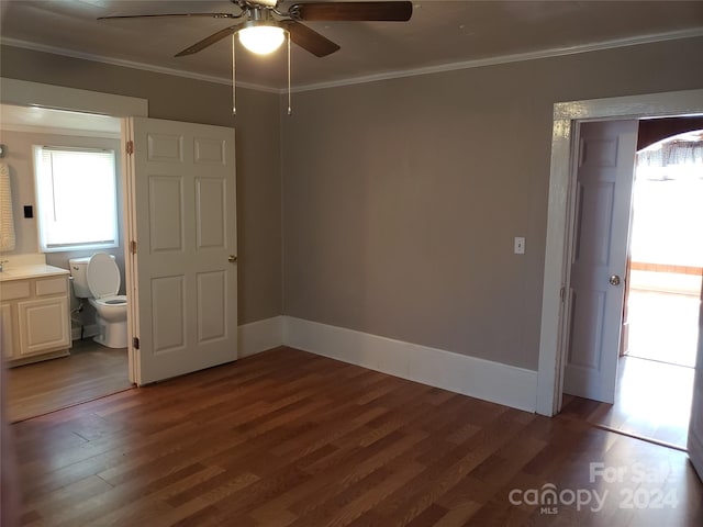 unfurnished bedroom with ornamental molding, hardwood / wood-style floors, ceiling fan, and ensuite bath