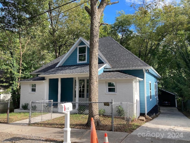 view of front of home featuring a porch and a carport