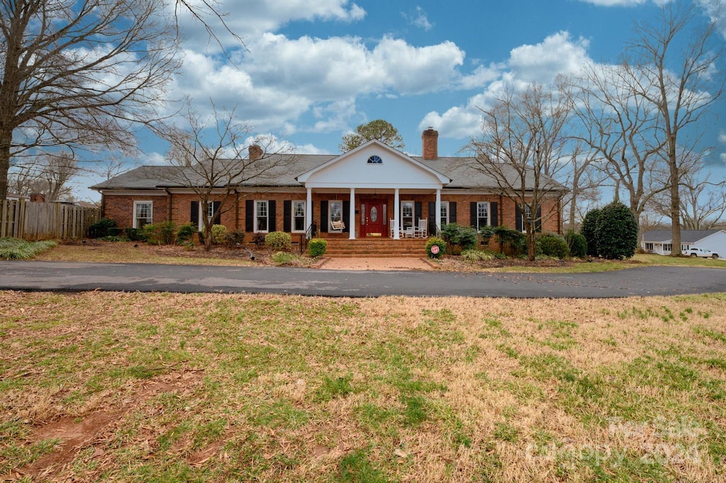 greek revival house with covered porch