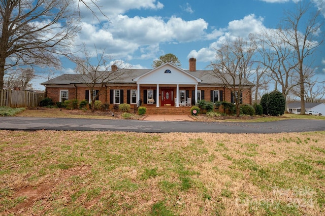 greek revival house with covered porch