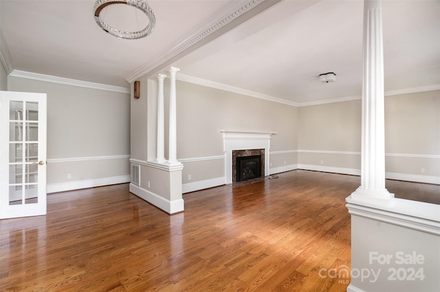 unfurnished living room with dark hardwood / wood-style floors, a high end fireplace, and crown molding