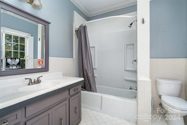 full bathroom with vanity, tile walls, toilet, and shower / tub combo with curtain