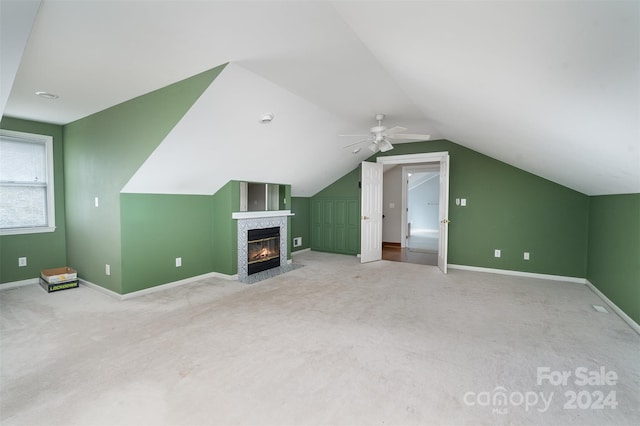 additional living space featuring lofted ceiling, ceiling fan, and light colored carpet