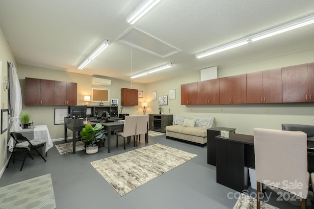 living room featuring concrete floors and a wall mounted air conditioner