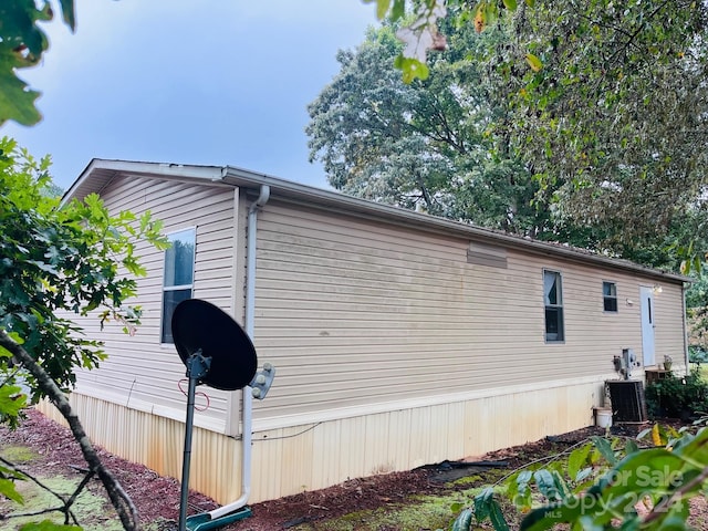 view of home's exterior with central AC unit