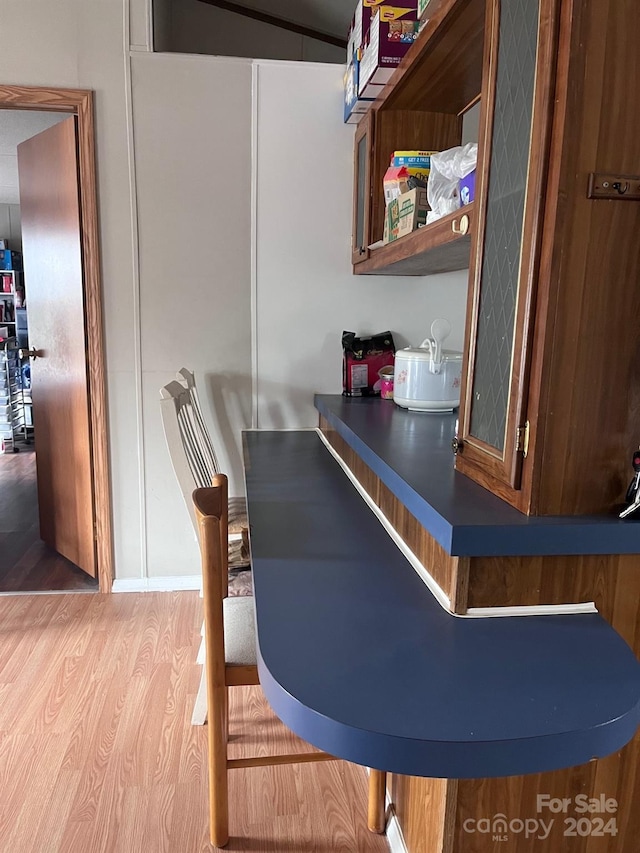 bar featuring light wood-type flooring