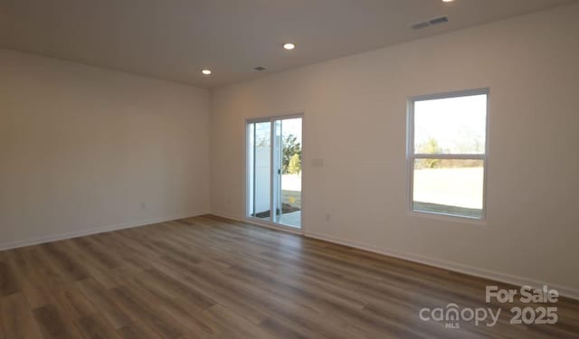 empty room featuring dark wood-type flooring