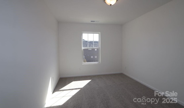 unfurnished room featuring carpet floors