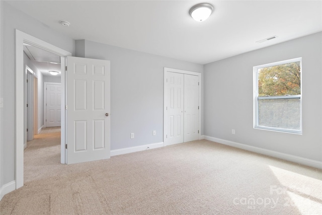 1038 Heath Helms Rd, Monroe, NC 28110 - unfurnished bedroom featuring attic access, carpet, and baseboards