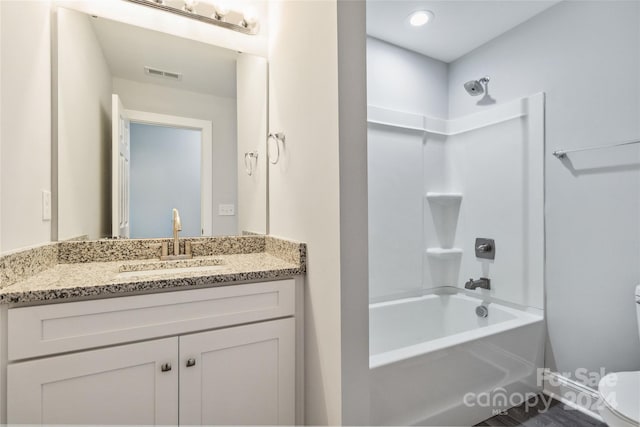 full bathroom with shower / bathing tub combination, vanity, and toilet