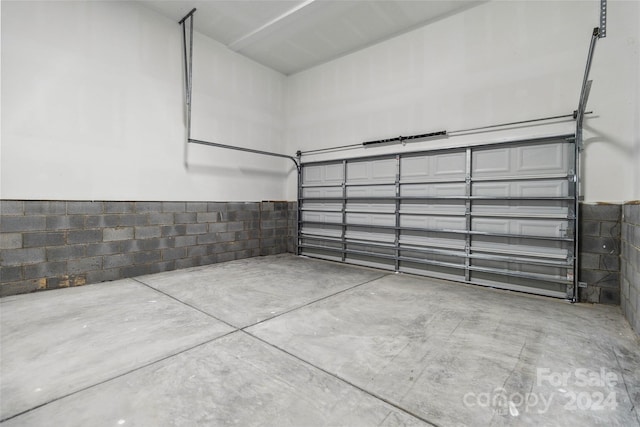 1038 Heath Helms Rd, Monroe, NC 28110 - garage featuring concrete block wall