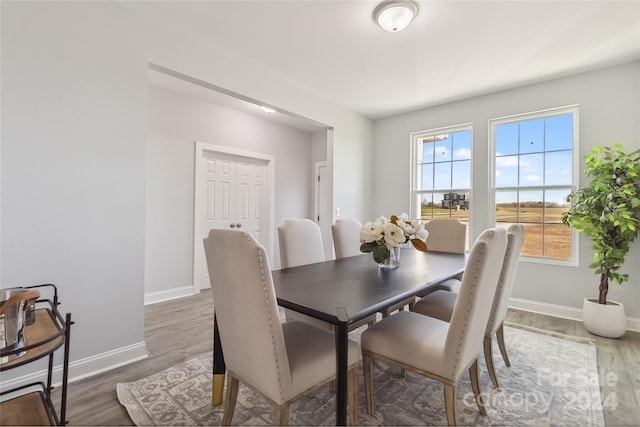 dining area with hardwood / wood-style floors