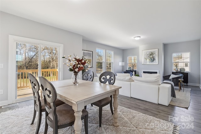 1038 Heath Helms Rd, Monroe, NC 28110 - dining space with wood finished floors and a fireplace
