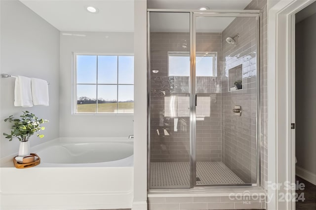 1038 Heath Helms Rd, Monroe, NC 28110 - bathroom with a shower stall, a bath, and recessed lighting