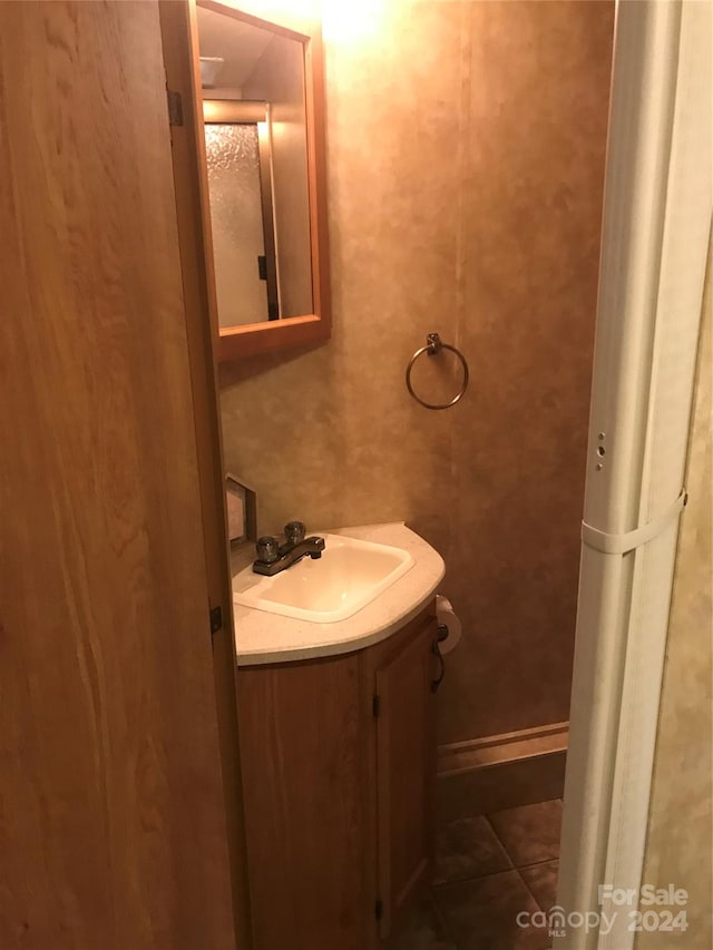 bathroom with vanity and tile patterned floors