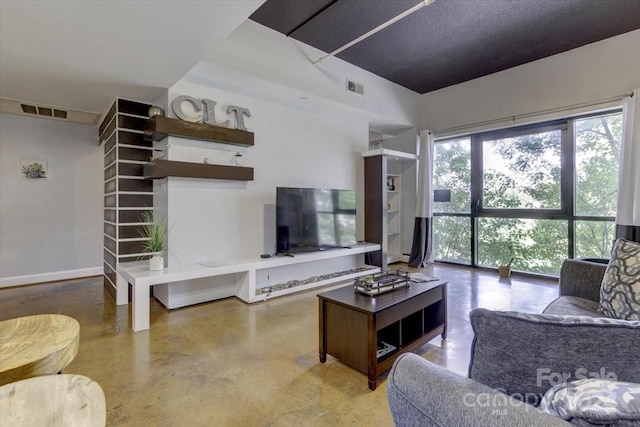 living room featuring concrete flooring