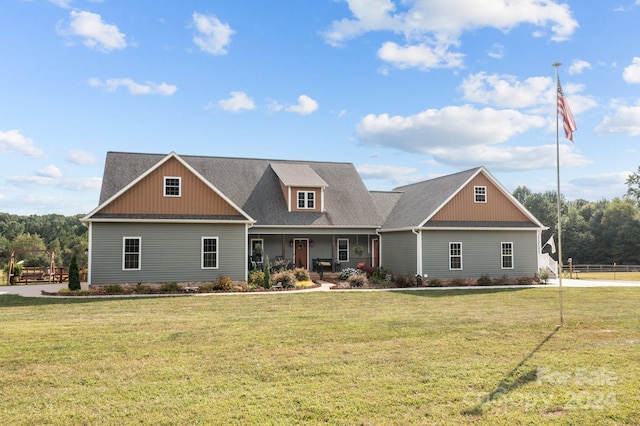 craftsman inspired home with a front lawn and covered porch