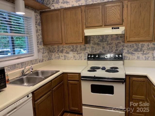 kitchen with sink and white appliances