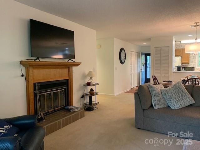 living room featuring light carpet and a textured ceiling