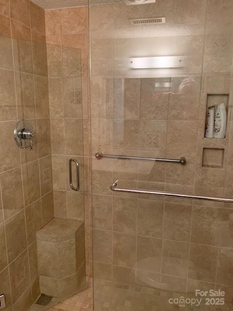 bathroom with an enclosed shower