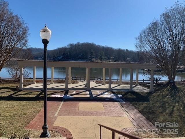 view of patio with a water view