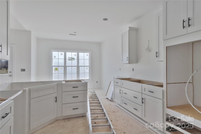 kitchen with white cabinets