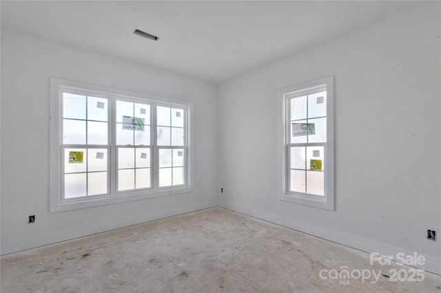 empty room featuring baseboards