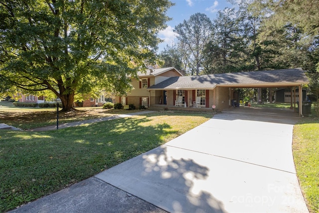 view of front facade featuring a front lawn and a carport