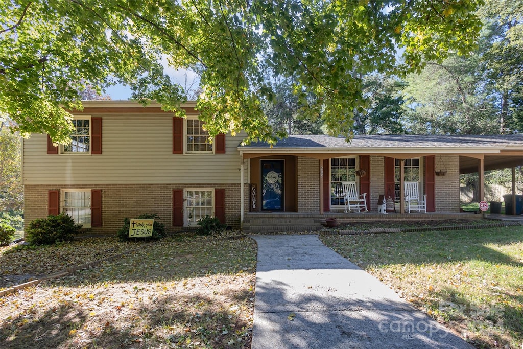 split level home with covered porch