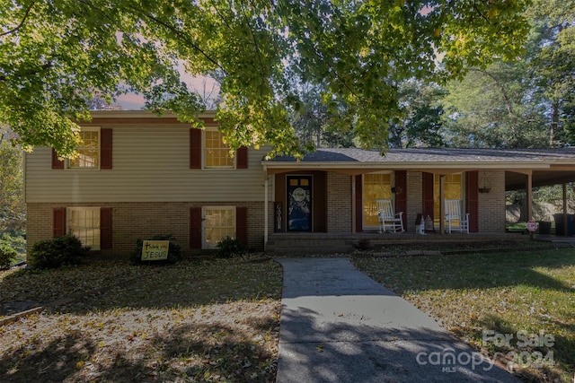 split level home featuring a porch