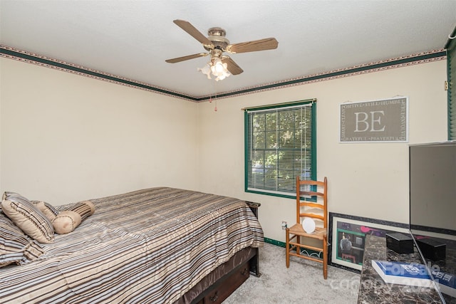 carpeted bedroom with crown molding, a textured ceiling, and ceiling fan