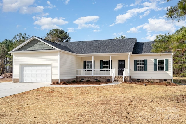 ranch-style house with covered porch and a garage