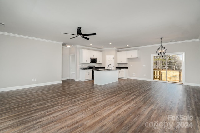 kitchen with white cabinetry, dark hardwood / wood-style flooring, an island with sink, decorative light fixtures, and appliances with stainless steel finishes