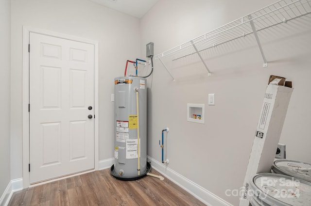 utility room featuring electric water heater