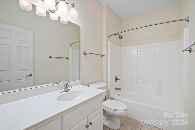 full bathroom with tub / shower combination, vanity, toilet, and tile patterned floors