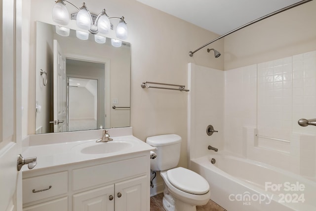 full bathroom featuring washtub / shower combination, vanity, and toilet